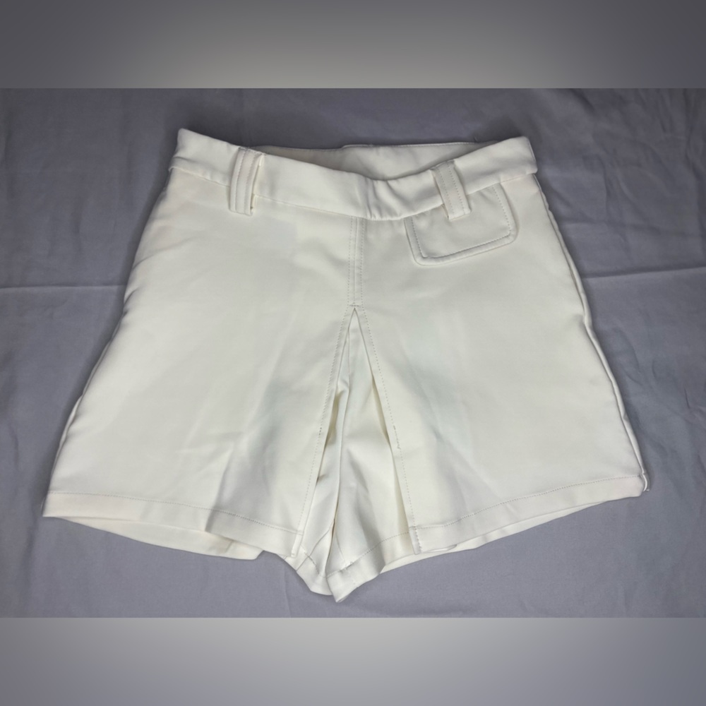 Day off-white high waisted shorts. Flaps on front & very cute & unique!
